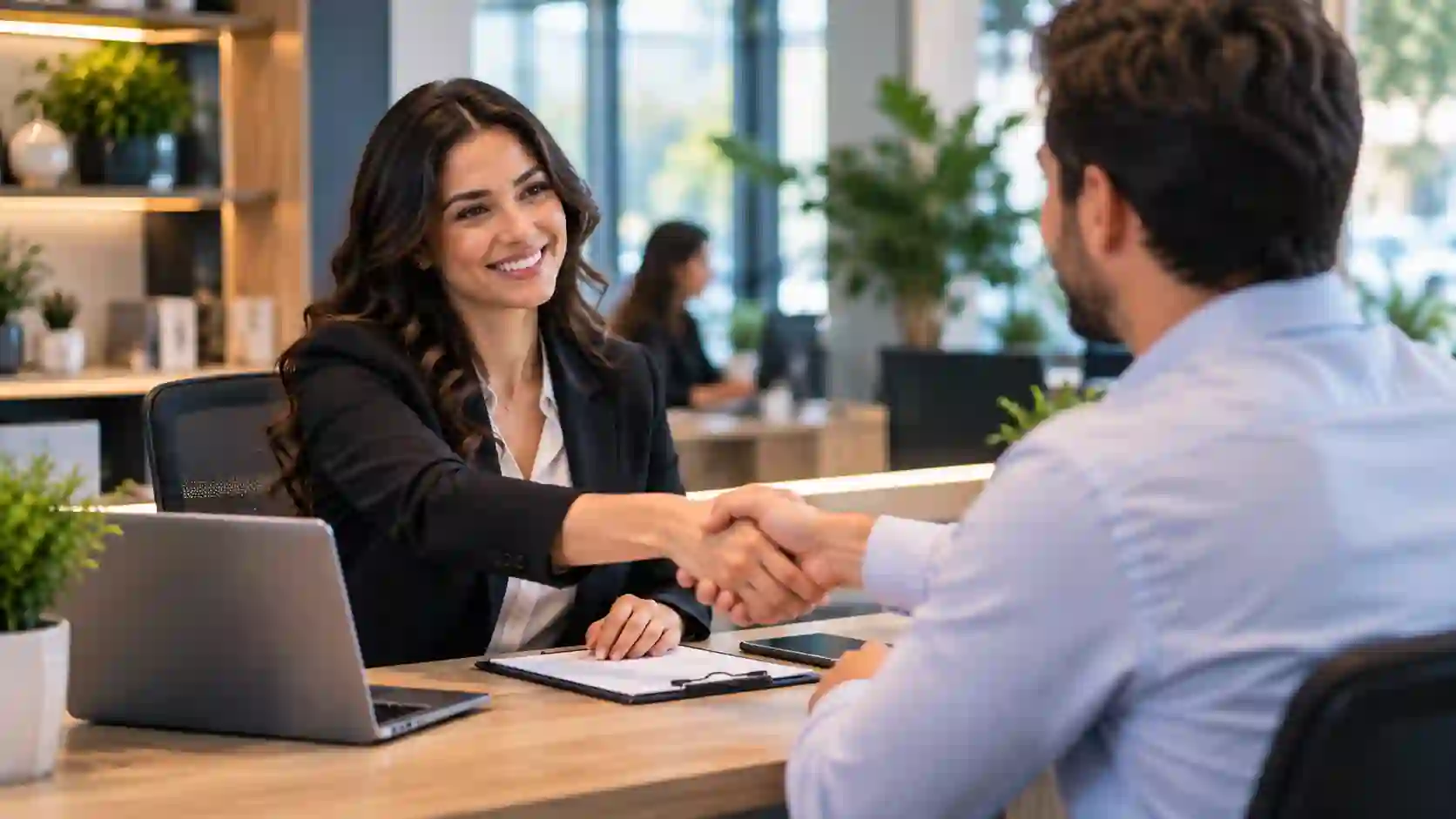 Sales jobs — a sales professional engaging warmly with a client